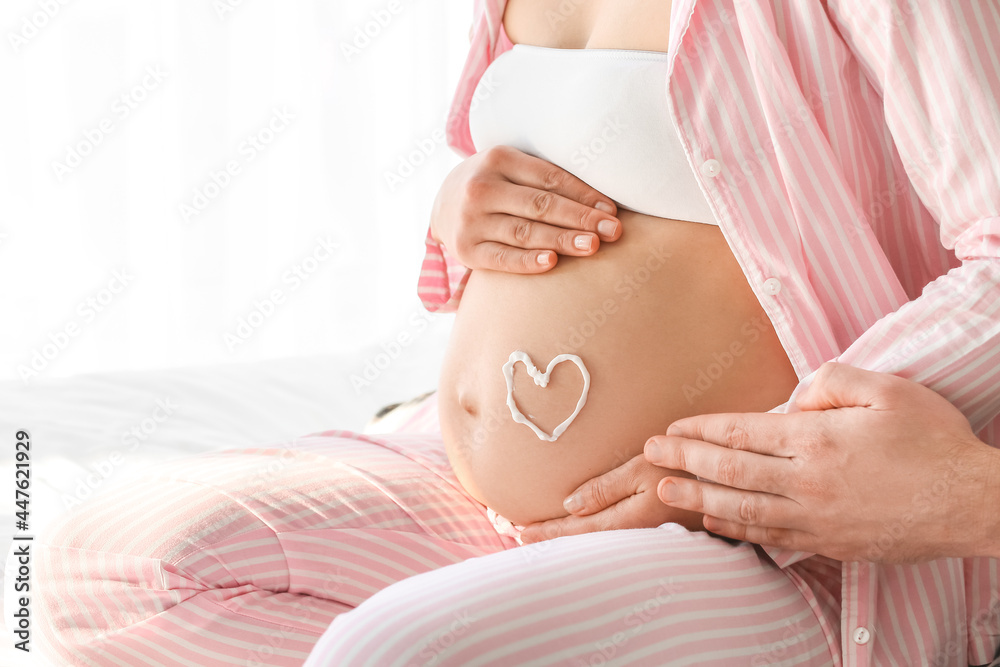 Beautiful pregnant couple at home