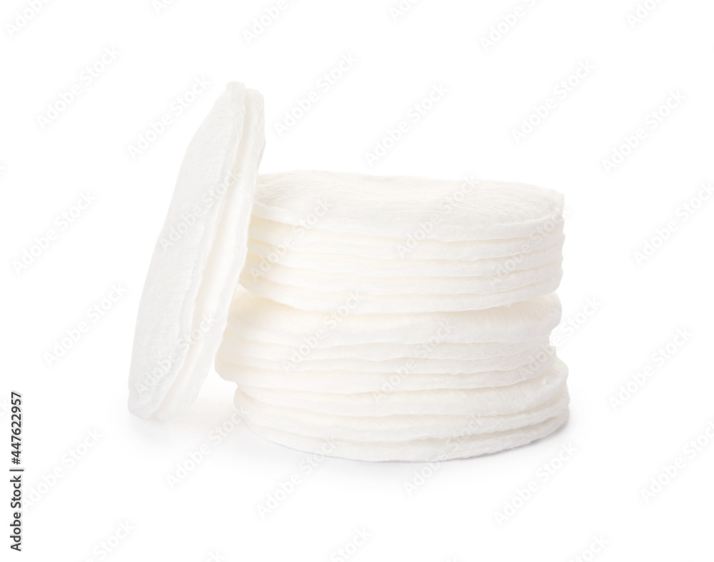 Stack of cotton pads on white background