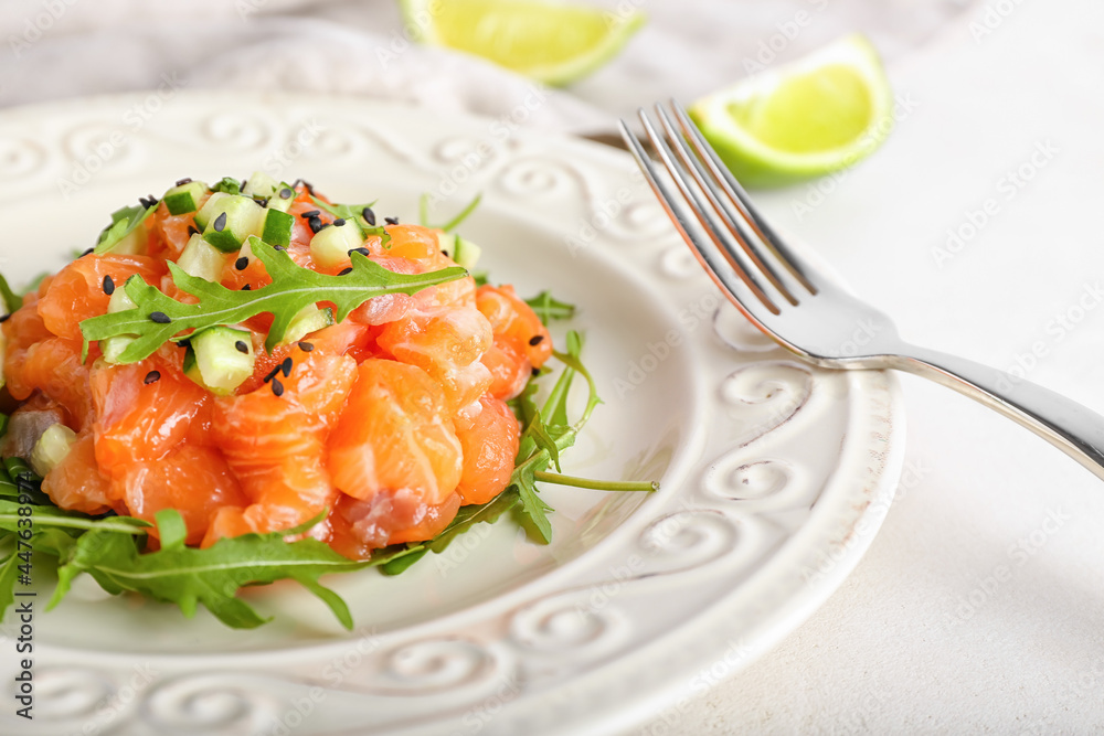 Delicious salmon tartar on light background, closeup