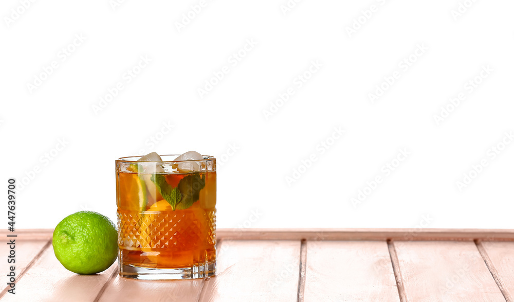 Glass of tasty cold ice tea on white background