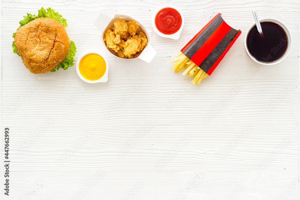 Layout of junk food - french fries burger and chicken nuggets