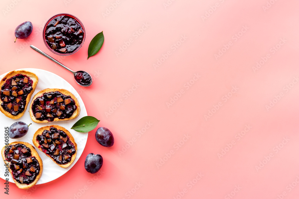 Toasted bread with plump jam. Food layout top view