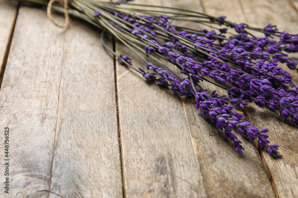 Beautiful lavender flowers on wooden background, closeup