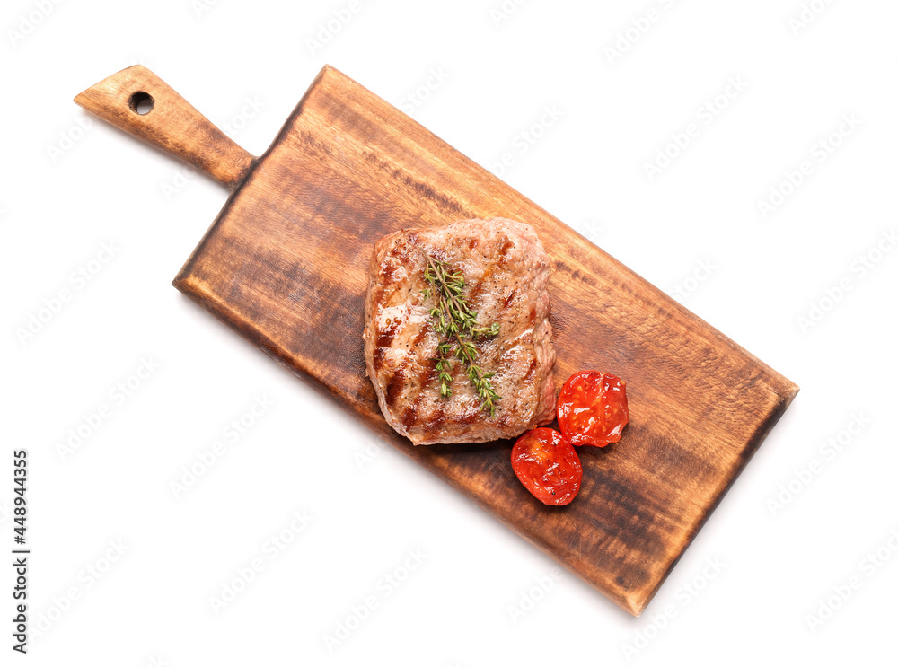 Wooden board with tasty beef steak on white background