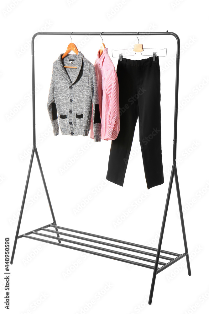 Rack with stylish school uniform on white background