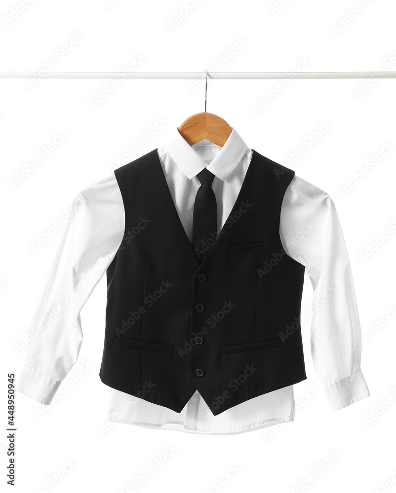 Rack with stylish school uniform on white background