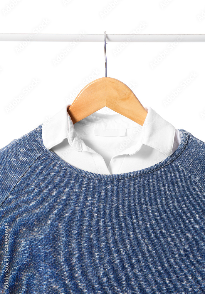 Rack with stylish school uniform on white background