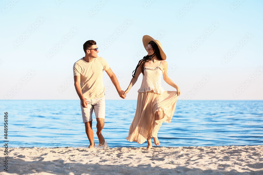 Happy young couple on sea beach