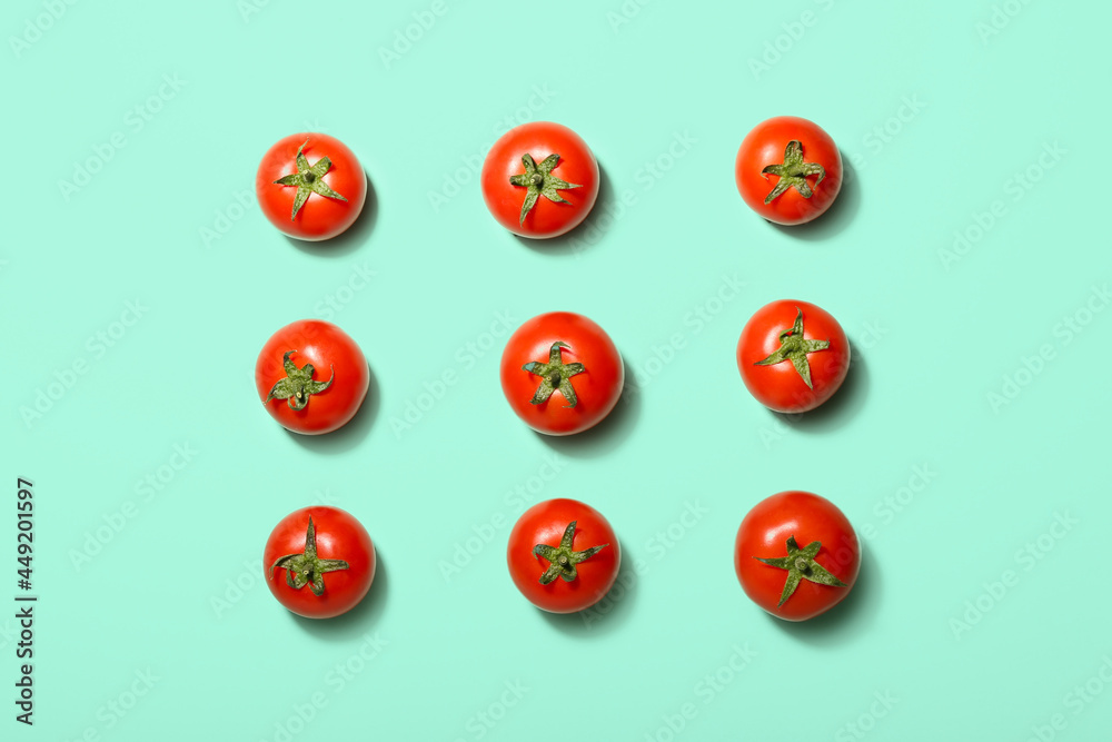 Fresh ripe tomatoes on color background