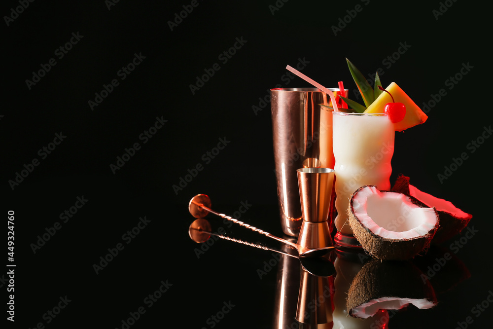 Glass with tasty Pina Colada cocktail on dark background