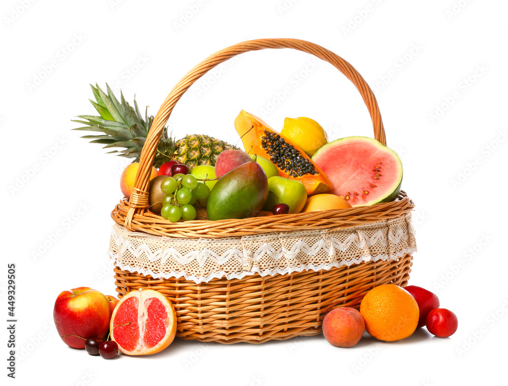 Basket with fresh fruits on white background