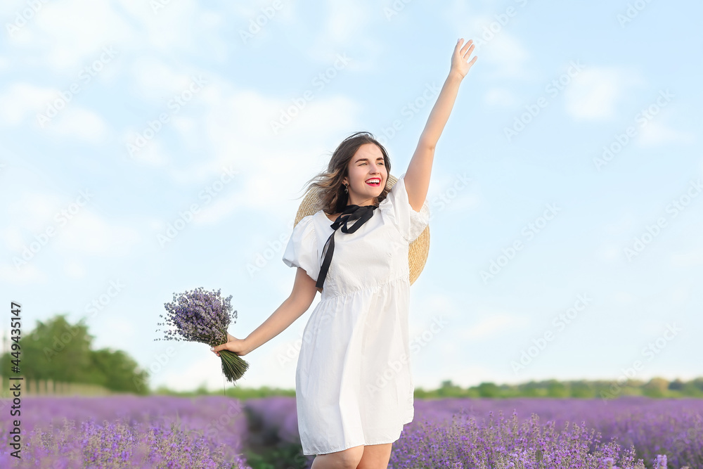 Beautiful young woman in lavender field