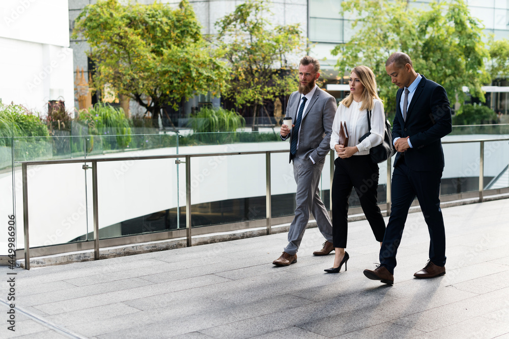 Business people walking together outside the office