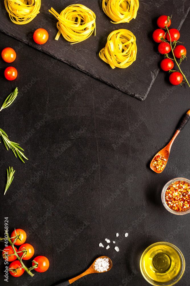 Pasta ingredients with tomatoes olive oil spices and herbs