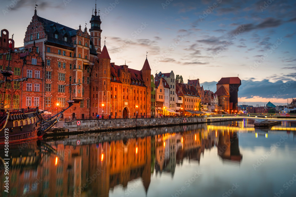 Gdansk with a historic crane at the Motława River at sunset, Poland.