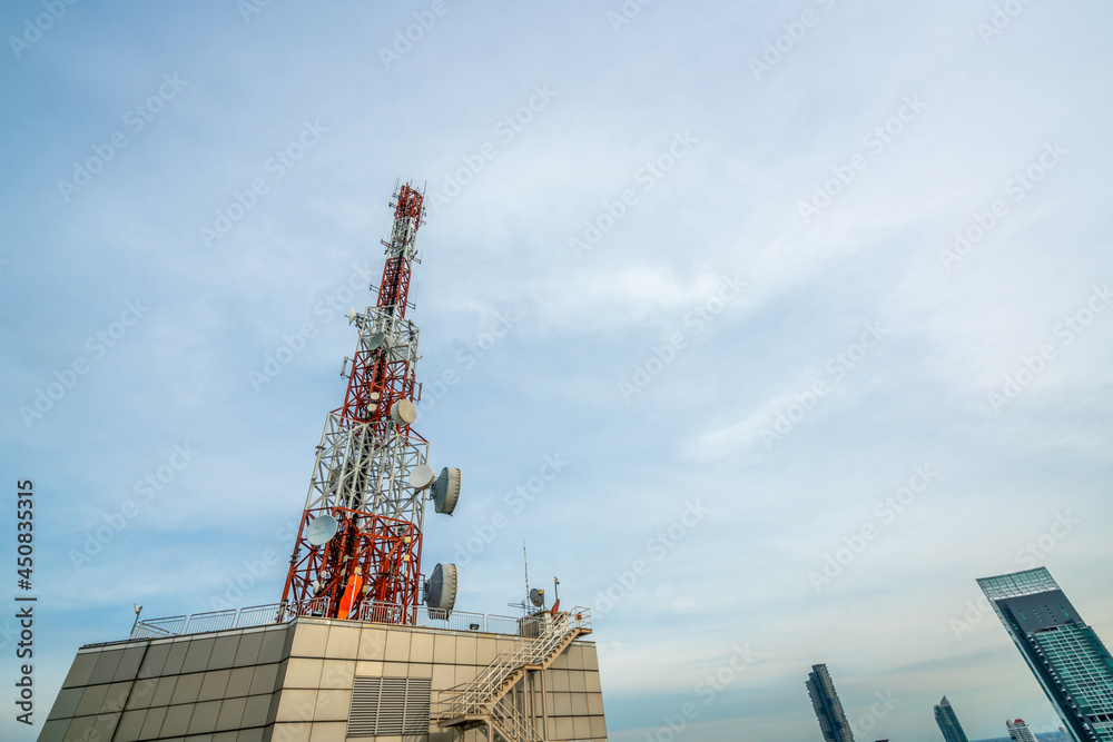 Large telecommunication tower against sky and clouds in background . Internet network connection con