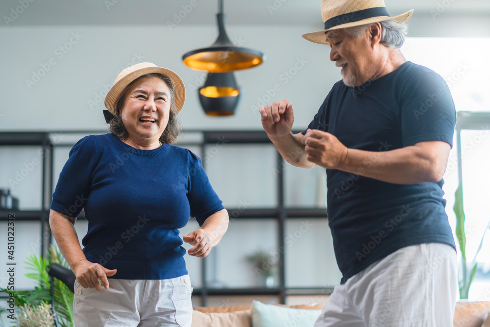 asian senior happiness couple home isolation concept,asian old retired adult couple dancing together