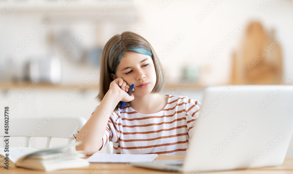 Girl doing homework or online education.