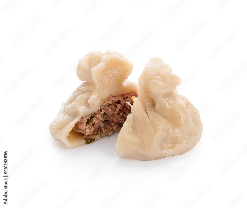 Cut tasty dumpling on white background