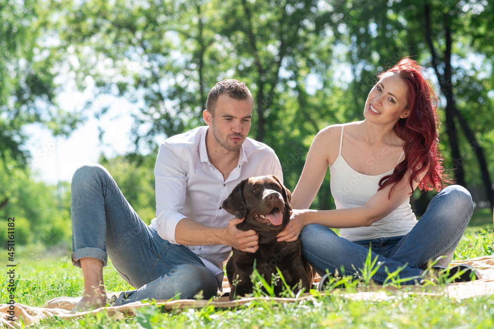 Couple with a dog in the park