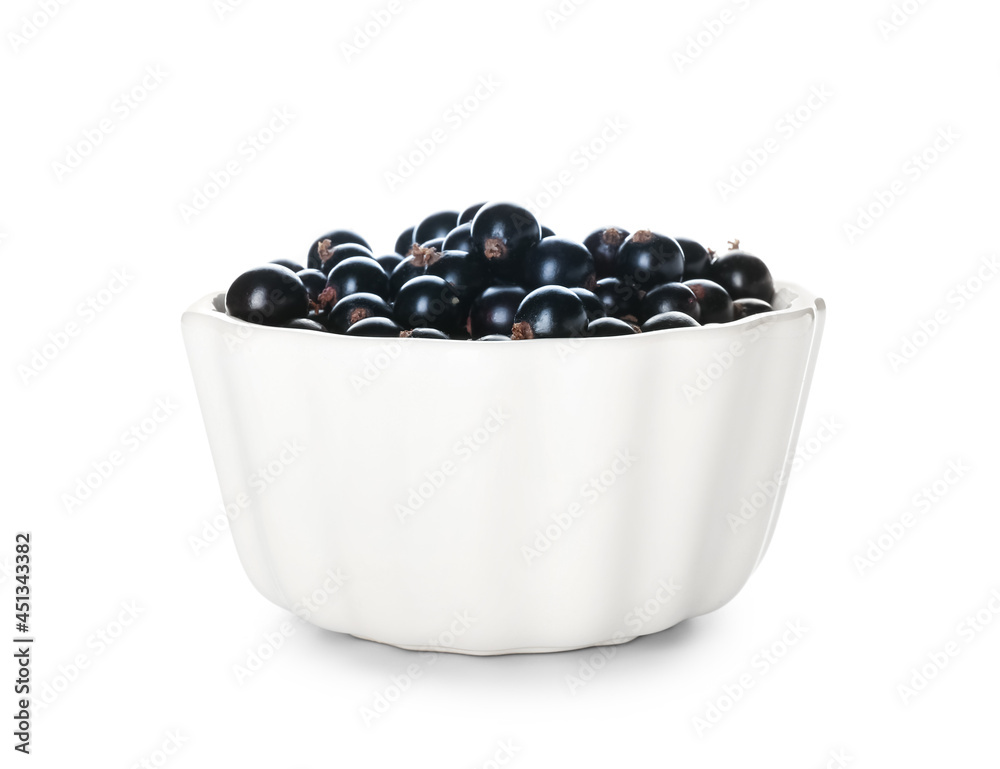 Bowl with ripe black currant on white background