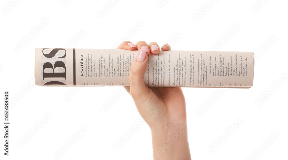 Female hand and newspaper on white background