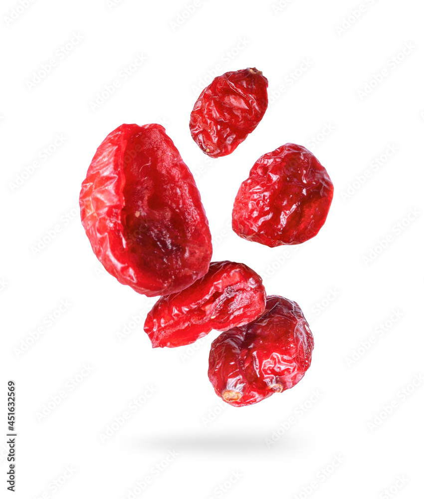 Dried cranberries close up in the air on a white background