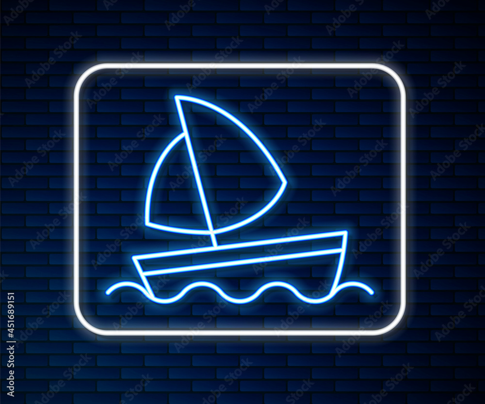 Glowing neon line Yacht sailboat or sailing ship icon isolated on brick wall background. Sail boat m