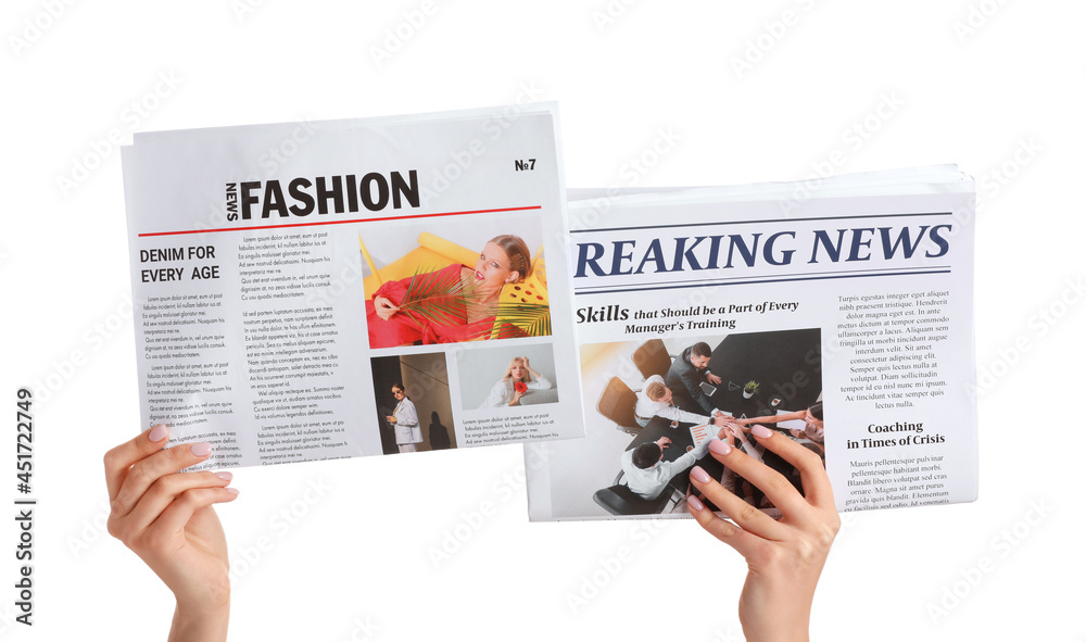 Female hands and newspapers on white background