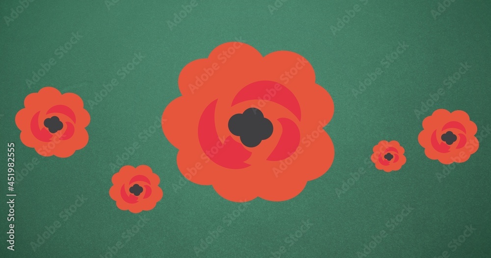 Composition of red flowers on green background