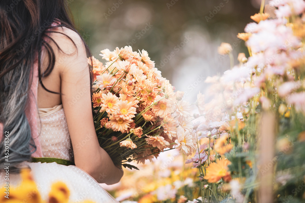 woman with flowers and nature concept,beautiful bouquet with woman in garden,