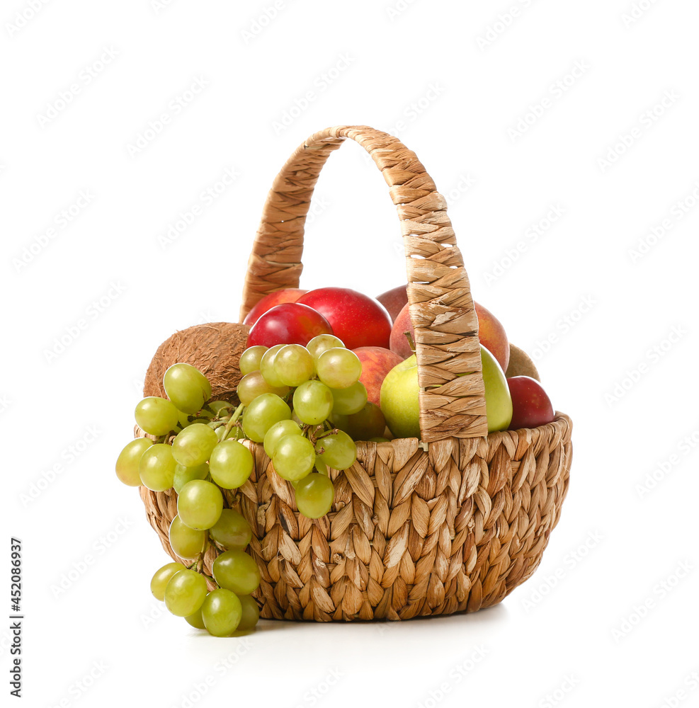 Basket with fresh fruits on white background