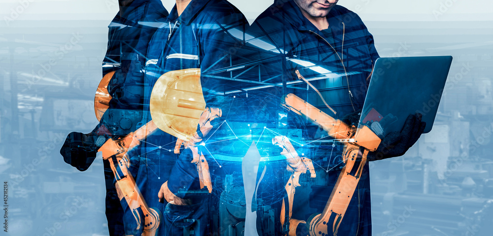 Mechanized industry robot arm and factory worker double exposure . Concept of robotics technology fo