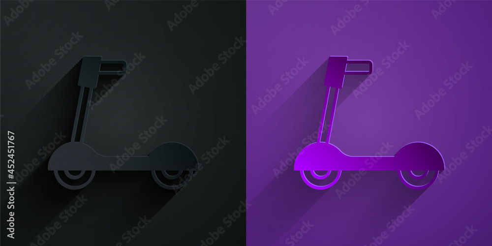 Paper cut Roller scooter for children icon isolated on black on purple background. Kick scooter or b