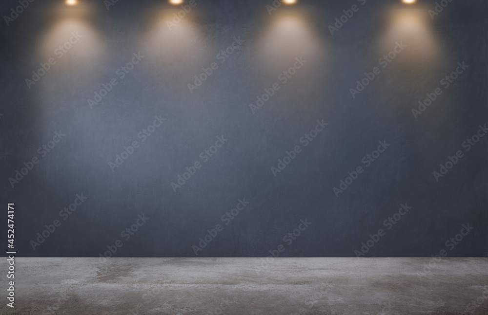 Dark gray wall with a row of spotlights in an empty room