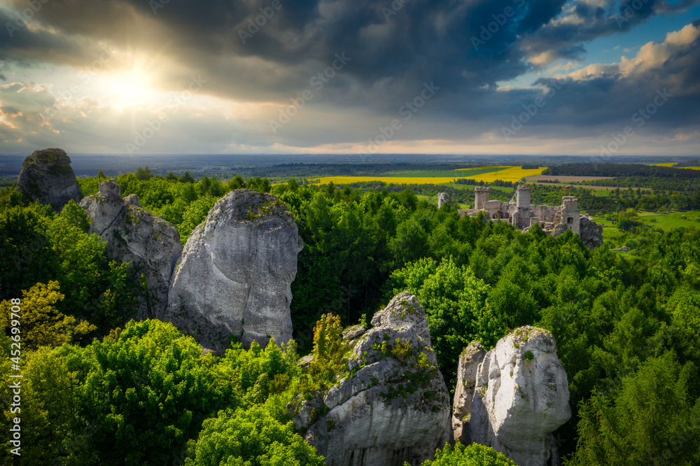 Ruins of beautiful Ogrodzieniec Castle in Poland at sunset.