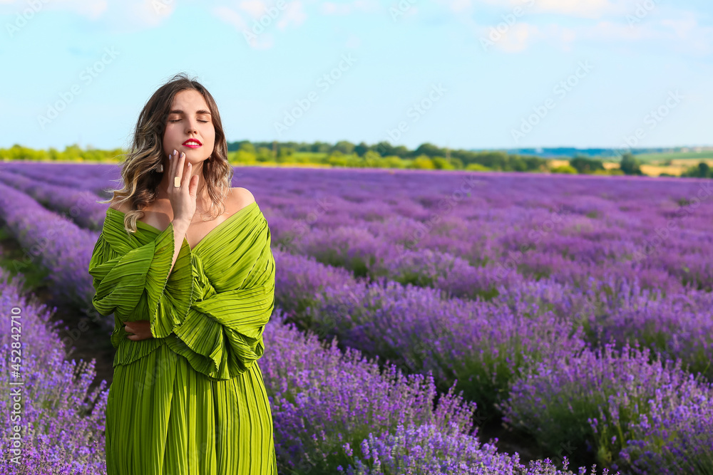 Beautiful young woman in lavender field