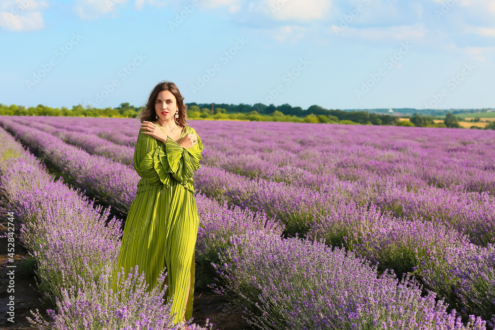 Beautiful young woman in lavender field