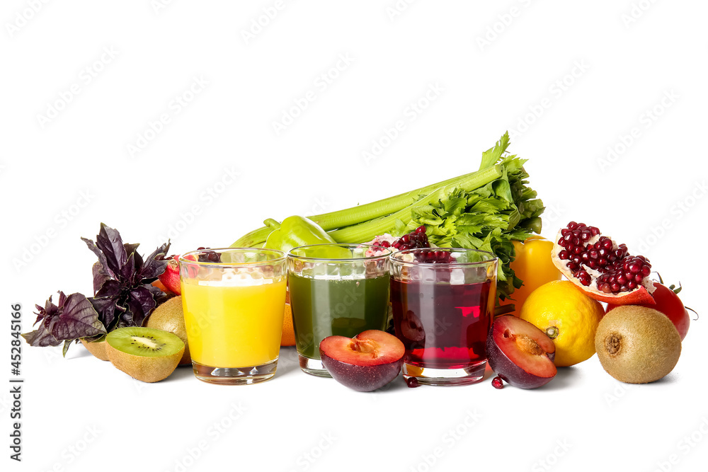 Glasses with healthy juice, fruits and vegetables on white background