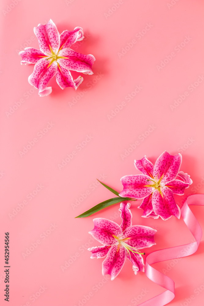 Top view of pink lilies flowers, floral pattern background