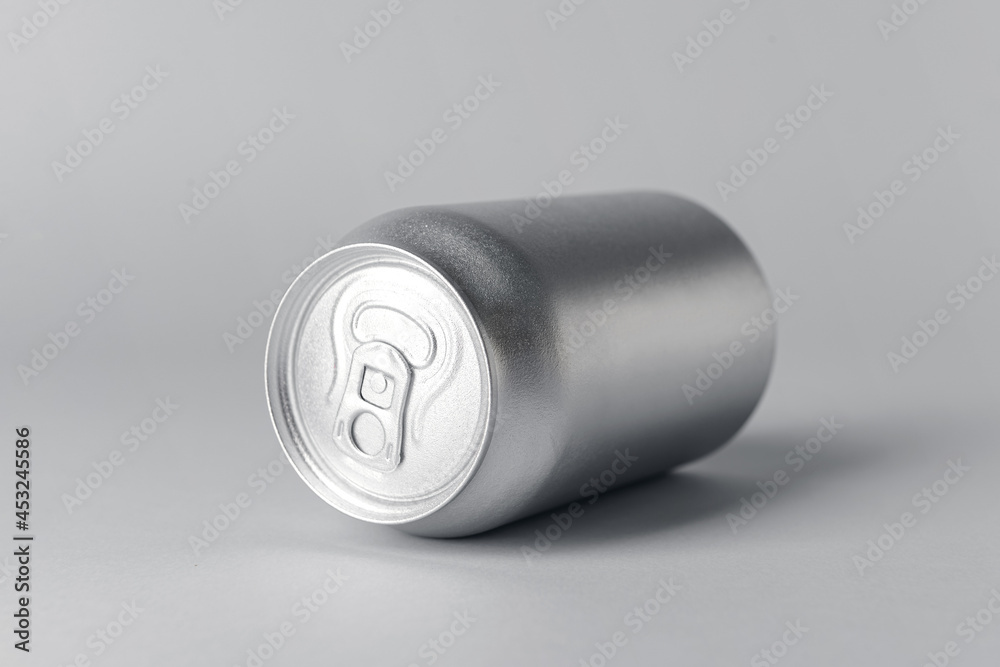 Can of soda on grey background