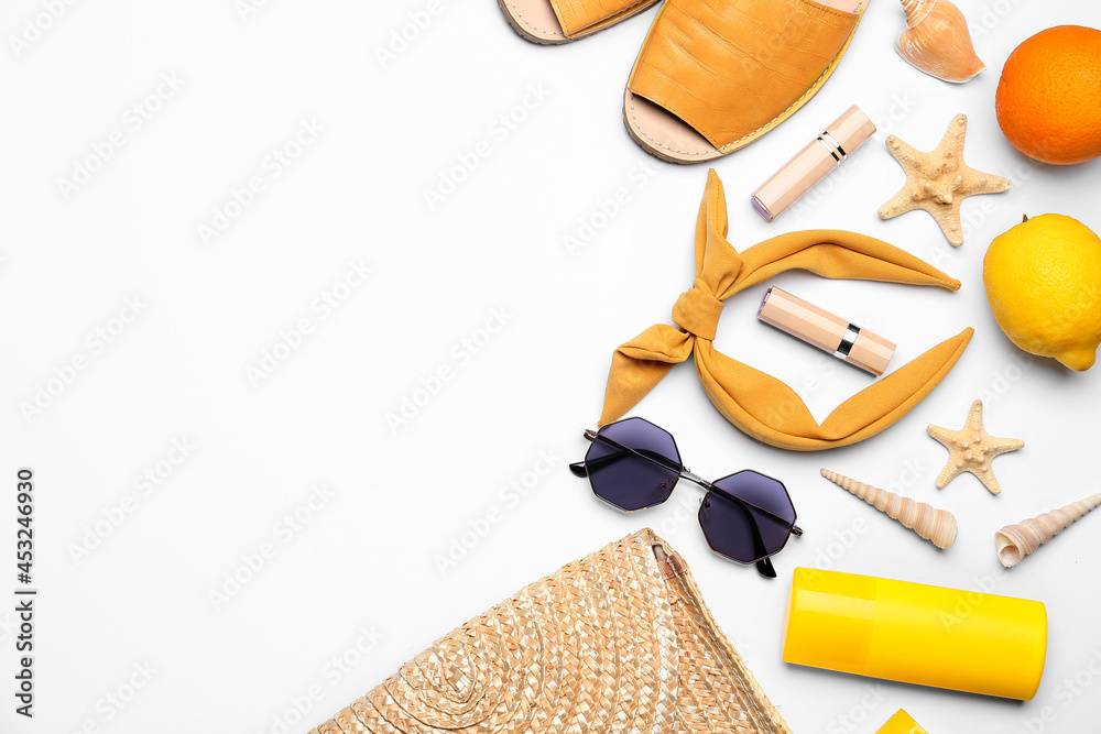 Set of beach accessories on white background