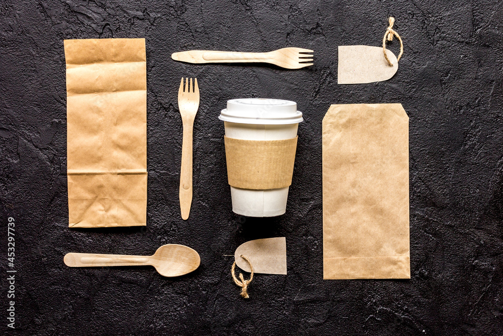 food delivery workdesk with paper bags and plastic cup table background top view mock-up