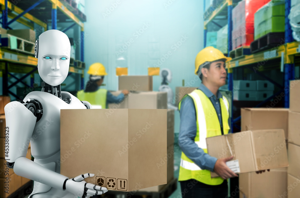 Innovative industry robot working in warehouse together with human worker . Concept of artificial in