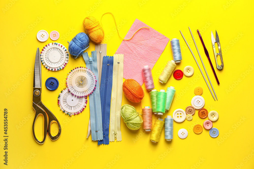 Composition with knitting supplies on color background