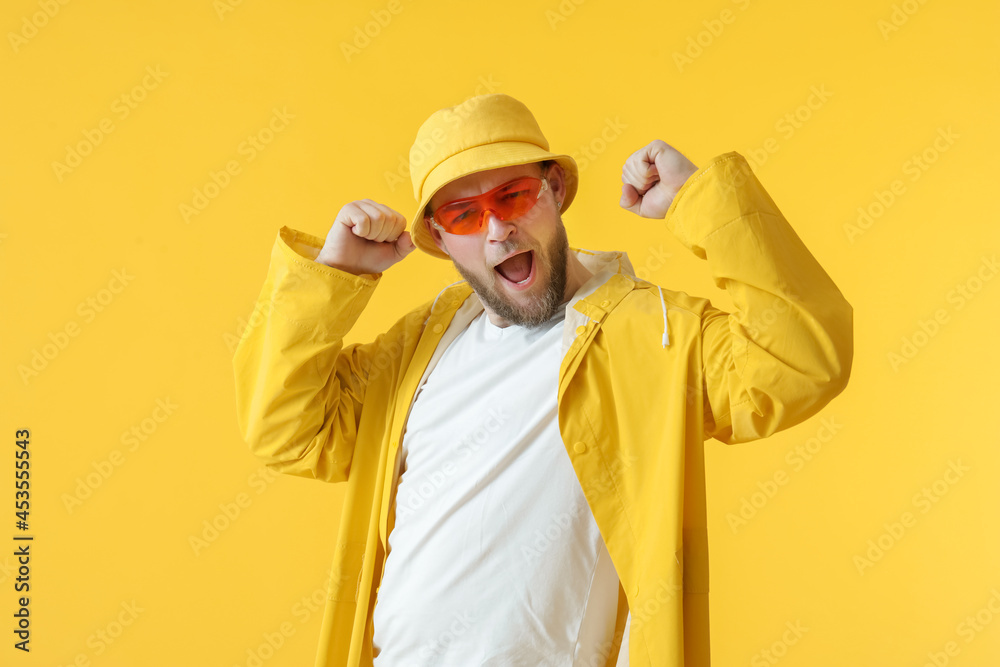 Handsome young man on color background