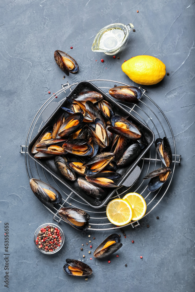 Composition with raw mussels on dark background