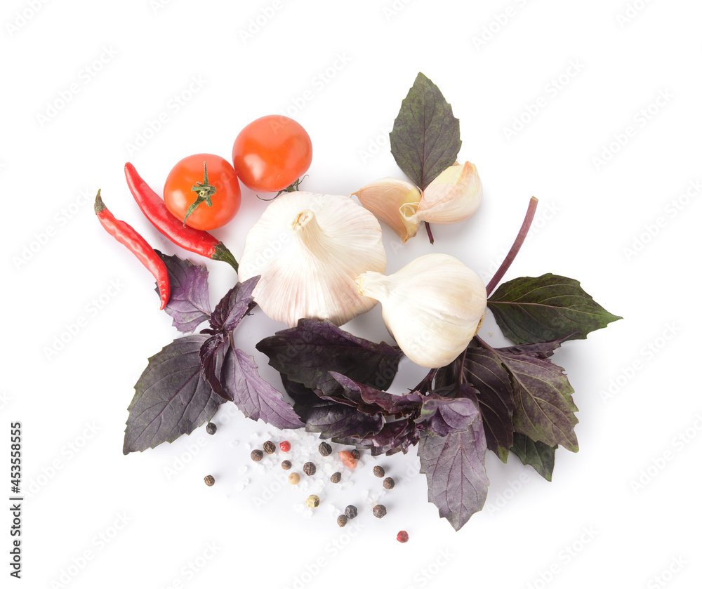 Fresh basil, garlic, tomato and chili pepper on white background