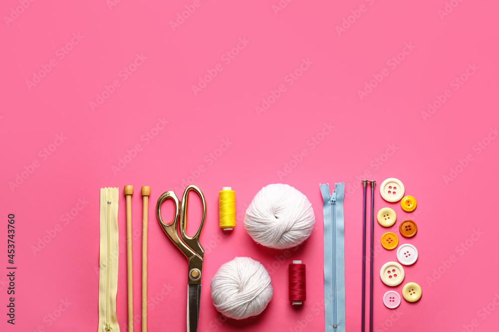 Composition with knitting supplies on color background