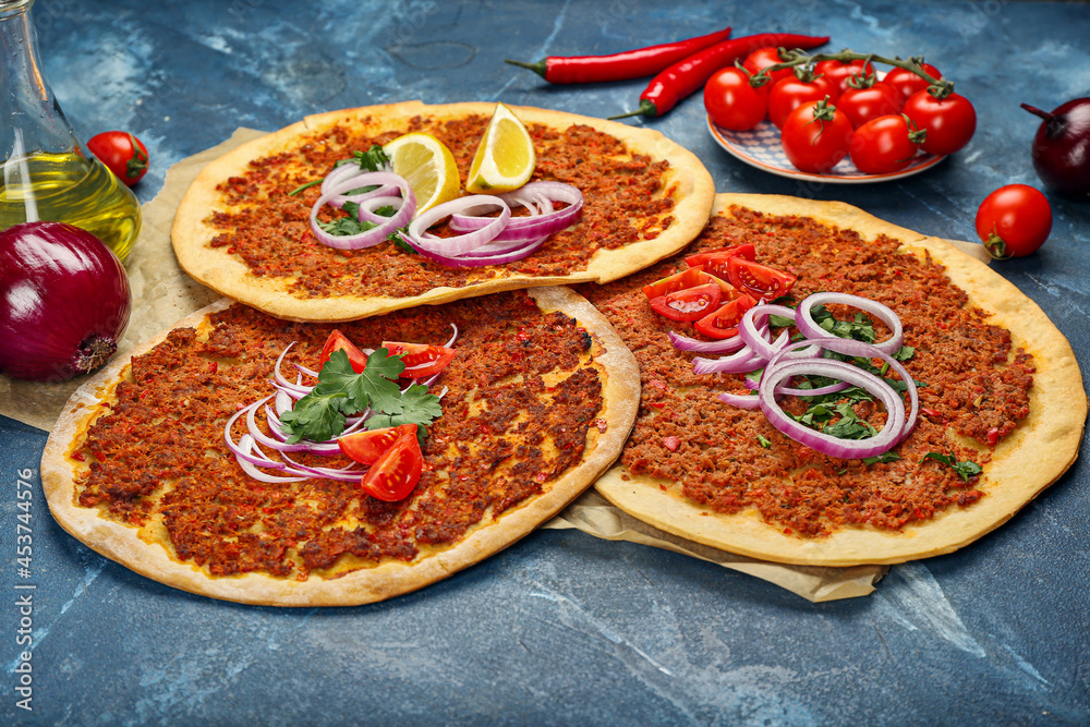 Delicious Turkish pizza on color background